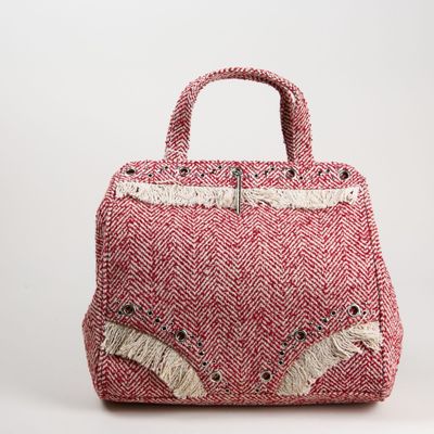 un sac rose et blanc orné d'un motif de chat sur le devant