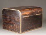 an old wooden box sitting on top of a white surface