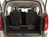 two seats in the back of a van with the door open
