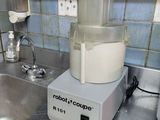 a blender sitting on top of a kitchen counter next to a sink