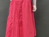 an image of a mannequin wearing a pink skirt and beige shirt