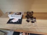 a pair of glasses and a magazine on a table