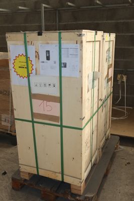 a pallet with a large box on it in a warehouse