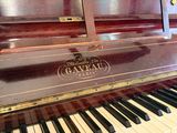 a piano that is sitting in the corner of a room