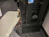an image of a computer in a room with a lot of clutter