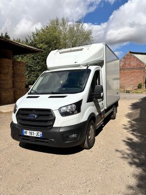 a white van that is parked on the side of the road