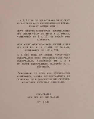 an open book with a black and white image of a clock on it