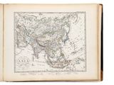 an old book with a map of asia on it