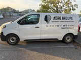 a white van that is parked in a parking lot
