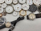 many different types of watches sitting on a table