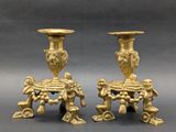 pair of antique brass candlesticks with cherenshes and cherenshes