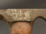 a close up of a hammer with a wooden handle