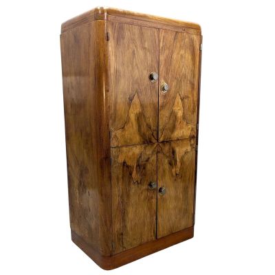 an image of a wooden cabinet with two doors and a drawer