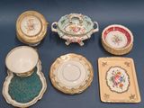 many plates and bowls that are sitting on a table