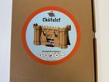 a cardboard box with a picture of a castle inside of it