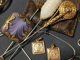 a lot of jewelry that is laying on a table