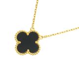 a black and gold necklace with a flower on it