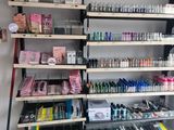 many shelves of nail polish and cosmetics products in this store