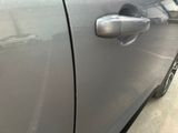 a close up of a car door handle with a sticker on it