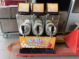 three machines that are sitting on a cart