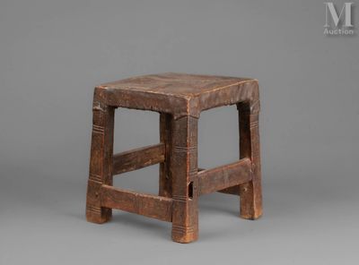 an old wooden stool on a gray background with a gray background