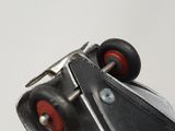 a close up of a pair of scissors on a piece of metal
