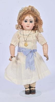 a doll that is wearing a white dress and a hat
