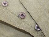 a close up of a button on a shirt that has buttons on it