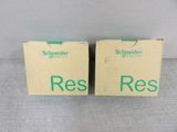 two boxes with the words res on them are sitting on a table