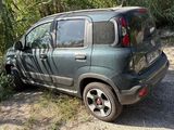 an image of a car that is parked in the dirt