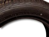 a tire on a white surface with a white background