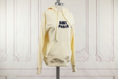 a mannequin with a yellow hoodie on it