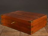 an old wooden box sitting on top of a wooden table