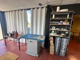 an image of a room with a desk and shelves
