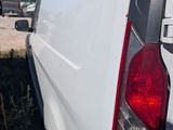 a white van that is parked in the grass
