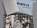 the contents of a john lelive watch are shown in a blue case