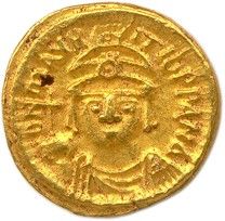 une pièce d'or portant l'image d'un homme