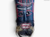 une image représentant un masque en bois orné d'une barbe et d'une moustache