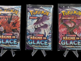 four packs of pokemon trading cards are displayed on a black background