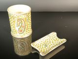 a small cup and a small plate on a table