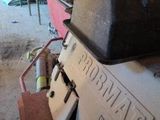 an image of a machine in a garage that is being worked on