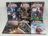 the star wars x - wing books are stacked on top of each other