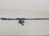 a fishing rod and reel sitting on top of a table