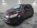 a picture of a maroon ford fiesta parked on a checkered floor