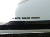 a close up of a car ' s emblem on the side of the car