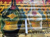 a large bottle of liquor on display in a store window