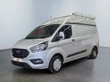 the white van is parked in a large room with a black floor