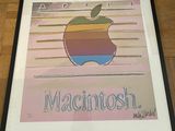 a picture of a picture of an apple logo on the wall