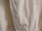 a person that is holding a towel in their hand