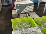 many empty plastic cups and containers on the floor